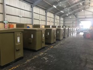 Refurbished transformer with new components and rewound windings.